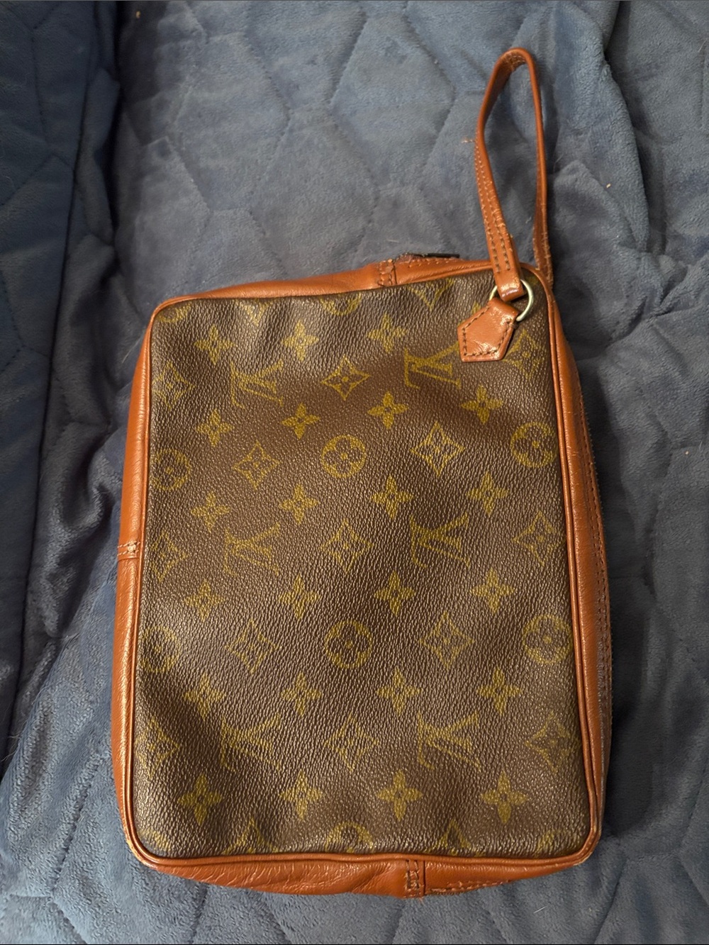 Louis Vuitton Brown Leather Monogram cosmetic case with wristlet strap.